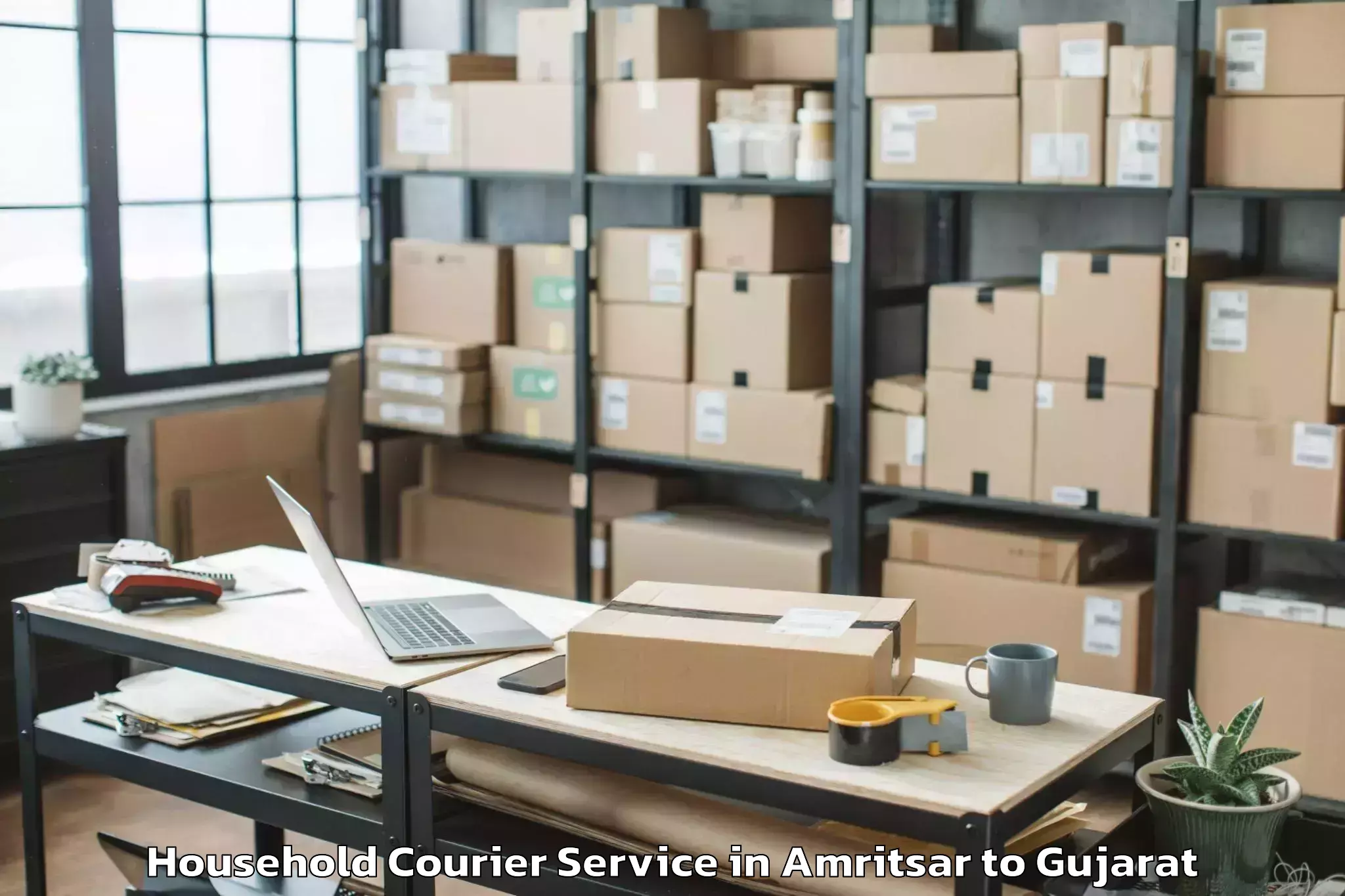 Professional Amritsar to Rai University Ahmedabad Household Courier